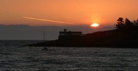 Sunrise behind the old lifeboat station near Abersoch